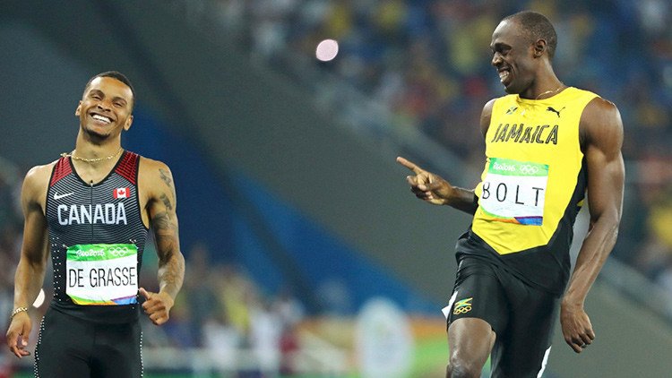 Usain Bolt intercambia sonrisas con su rival durante la semifinal de los 200 metros (fotos)