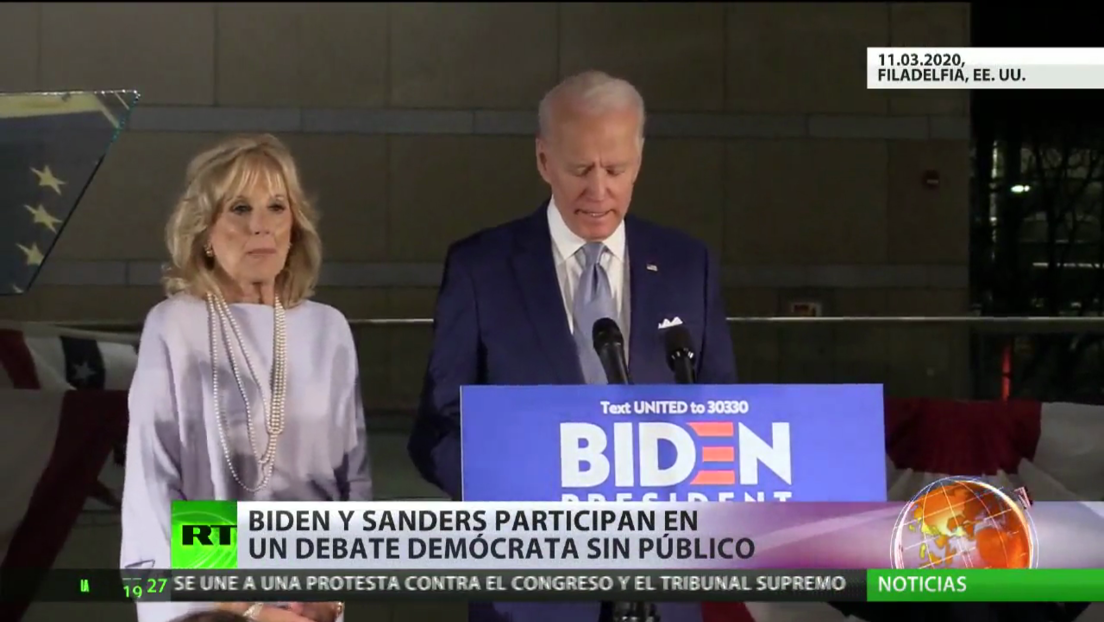 Los precandidatos Joe Biden y Bernie Sanders participan en un debate de las primarias celebrado sin público por el covid-19