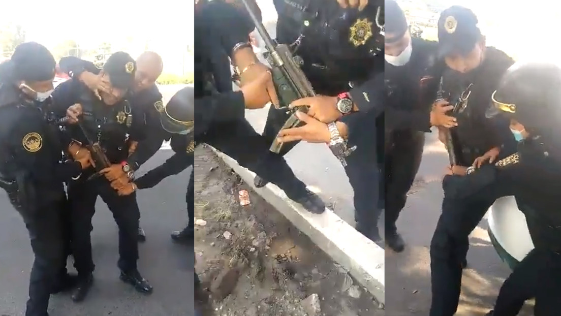 VIDEOS: Policías de Ciudad de México forcejean por un arma y esta termina disparándose en plena vía pública