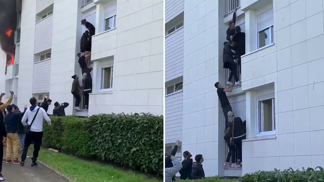 VIDEO: Decenas de jóvenes forman una escalera humana para rescatar a una familia de un edificio en llamas