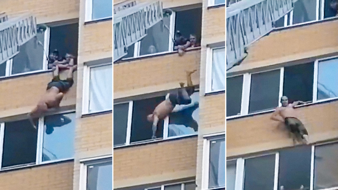 VIDEO: Hombre cae por una ventana de un edificio, pero se salva al agarrarse a la cornisa