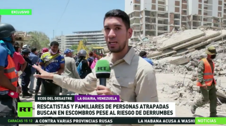 Rescatistas y familiares de personas atrapadas buscan en escombros pese al riesgo de derrumbes en Venezuela