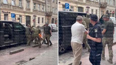 VIDEO: Reclutadores ucranianos agarran a un hombre de brazos y piernas y lo arrojan a la fuerza a una furgoneta
