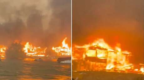 Fuego sobre el agua: espeluznante incendio arrasa con casas y cabañas a orillas de un lago (VIDEO)