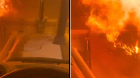 IMPRESIONANTE VIDEO: Maneja entre humo y fuego para contener un incendio que amenaza viviendas