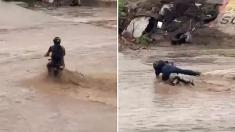 Ni la fuerza del agua logra separarlo de su moto: tensa escena en medio de la corriente (VIDEO)