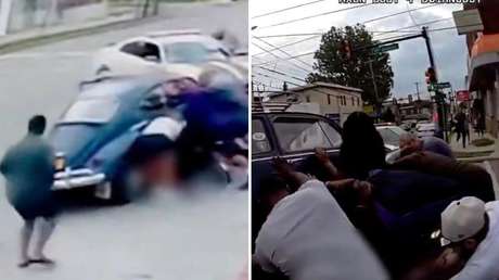 IMÁGENES IMPACTANTES: Transeúntes unen fuerzas para levantar un auto y salvar a una mujer atrapada