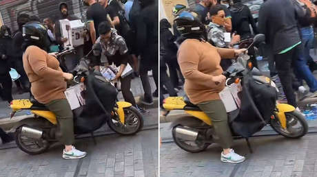 Mamá al volante y el hijo 'de compras': insólita escena durante un saqueo en Francia (VIDEO)