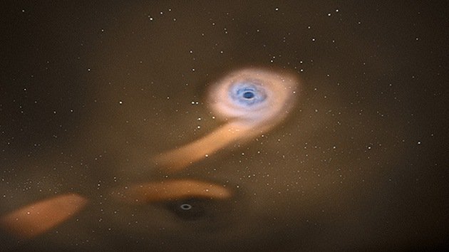 Un tándem de dos agujeros negros destroza una estrella