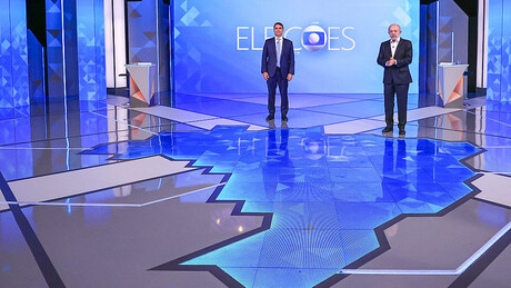 Lula e Flávio Bolsonaro trocam críticas sobre poder de compra e salário mínimo em debate na Globo