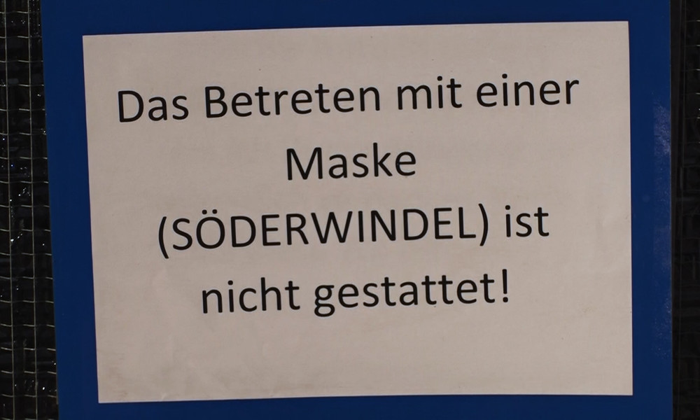 Runter mit der Maske! Kfz-Werkstatt in Bayern leistet stillen Widerstand (Video)
