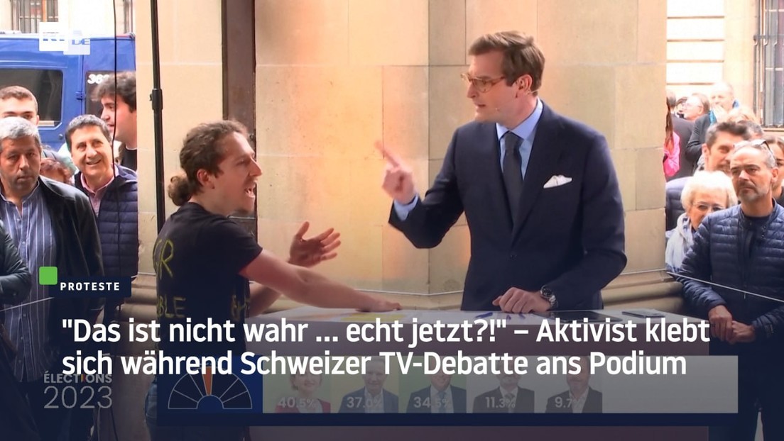 "Das ist nicht wahr … echt jetzt?!" – Aktivist klebt sich während Schweizer TV-Debatte ans Podium