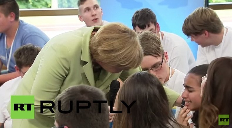 ‘We can’t manage all you coming’: Merkel makes Palestinian girl cry, then pets her
