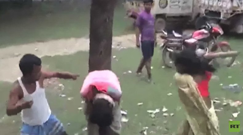 Vigilantes in India tie suspected molester to tree, beat him with broom (VIDEO)