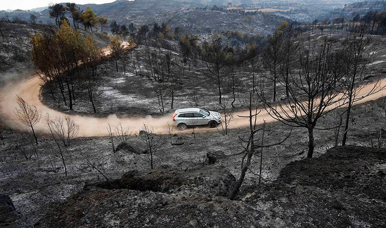Spanish firefighters go on strike as flames sweep Catalonian forests