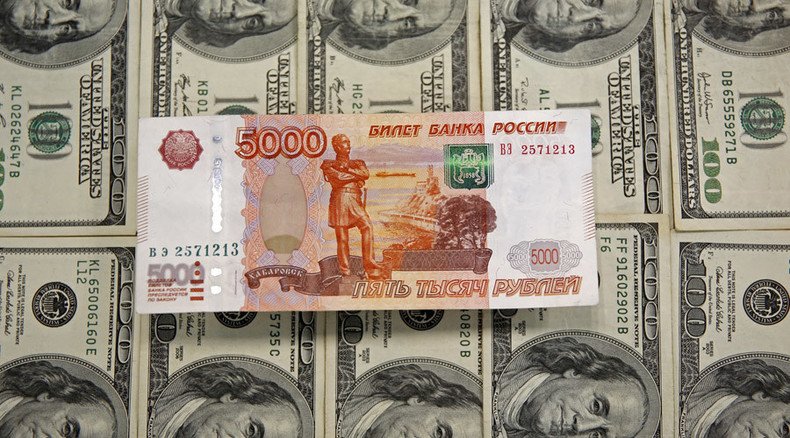 Russian ruble hits 60 against US dollar, close to erasing 2015 gains