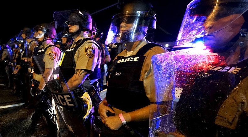 Picture of student shielding cops in Ferguson goes viral, becomes meme, leads to death threats