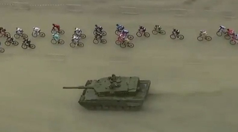 Athletes v Army: Surprise tank challenges cyclists in Norway's Arctic Race