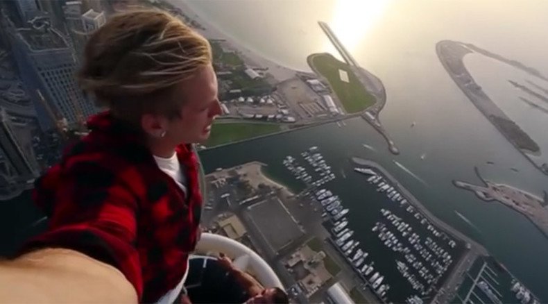 Russian vertigo-defying ‘rooftopper’ backflips on the edge of a 101-story building (VIDEO)