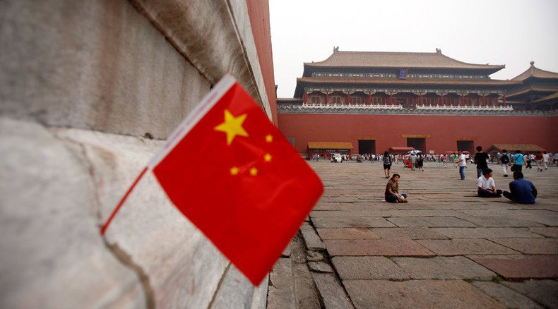 China stocks down again on volatile global trading