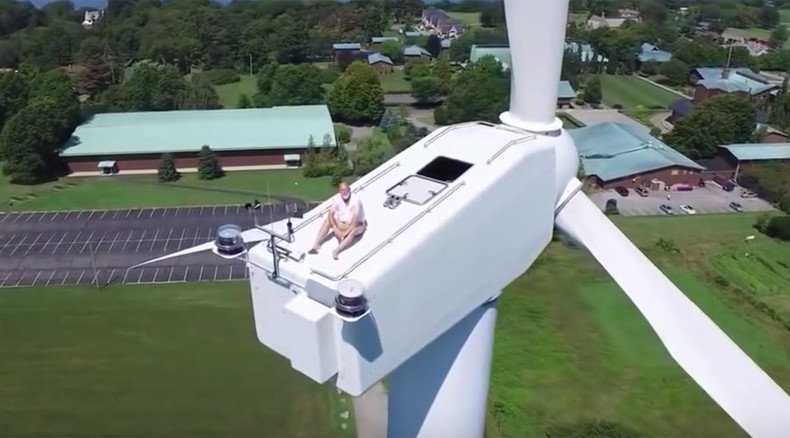 No privacy left in the world: Drone finds man sunbathing atop wind turbine (VIDEO)