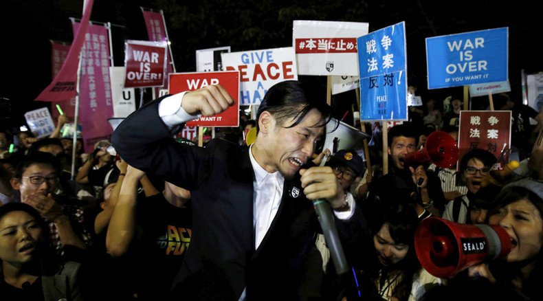 ‘War is over!’ Scuffles in Tokyo as anti-military protesters rally against Abe policy