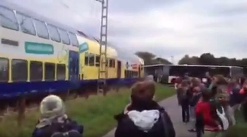 Train crashes into school bus stuck at rail crossing in Germany (VIDEO)