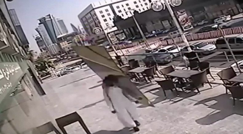 Huge glass panel falls inches from Saudi man’s head (VIDEO)