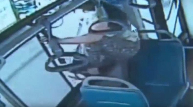 ‘I want to get off NOW’: Chinese woman misses stop, jumps out of moving bus window  (VIDEO)