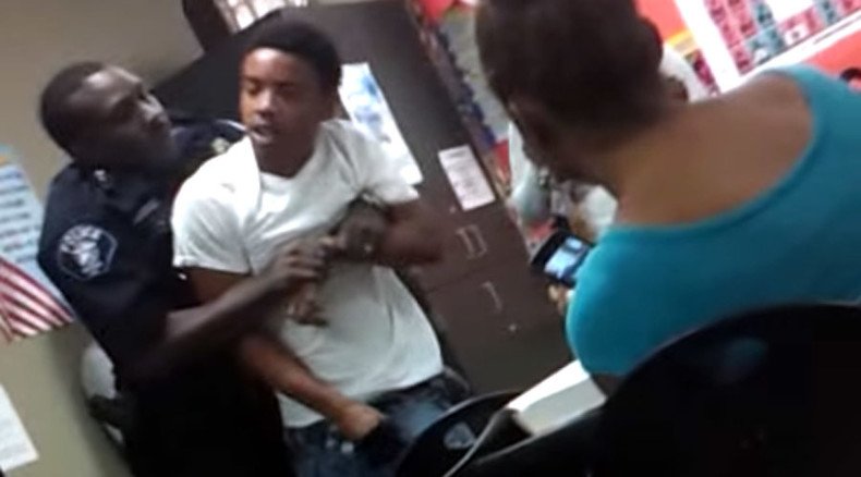 Cop throws punches at provocative student in classroom (VIDEO)