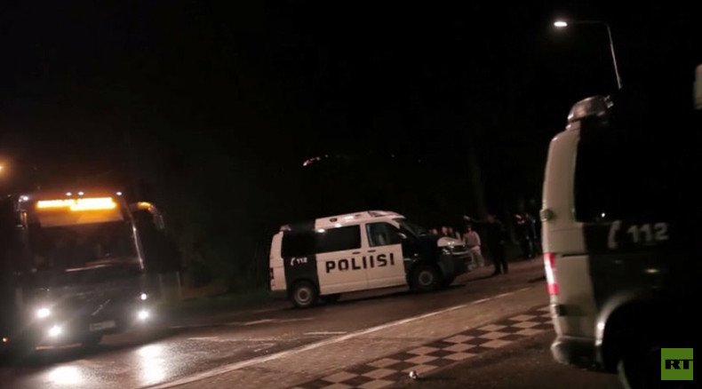 Rocks, fireworks, KKK outfit: Finland protesters attack bus with refugees (VIDEO)