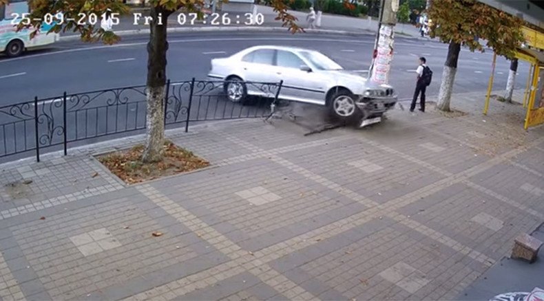 Narrow escape: Boy steps aside seconds before car slams into same place (VIDEO)