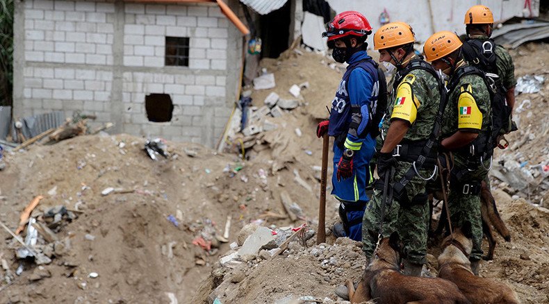 ‘Dead families huddled together’: Guatemala uncovers mudslide victims as death toll surges