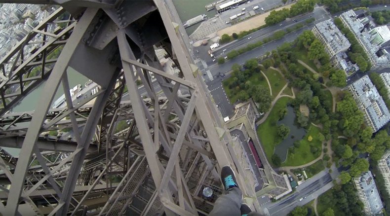 Dizzying footage shows pair climbing Eiffel Tower without harness (VIDEO)