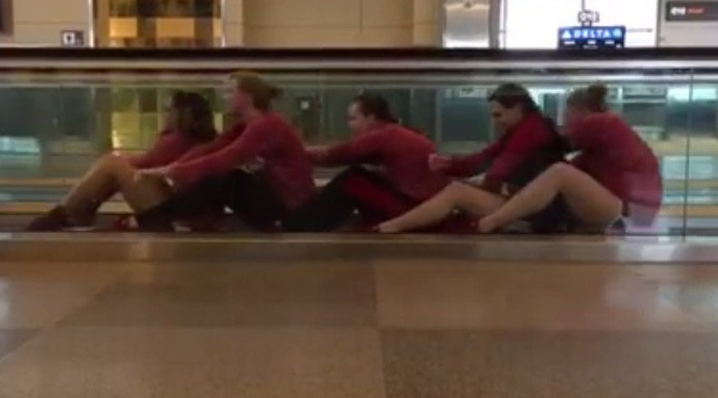 Row! Swim & dive team turns airport delay into hilarious performance (VIDEO)