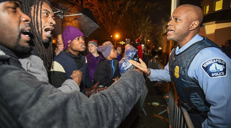 Police use chemicals on protesters as officers who shot Jamar Clark in head named 