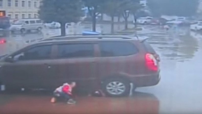 Close call: Two Chinese toddlers survive being run over by a car (VIDEO)