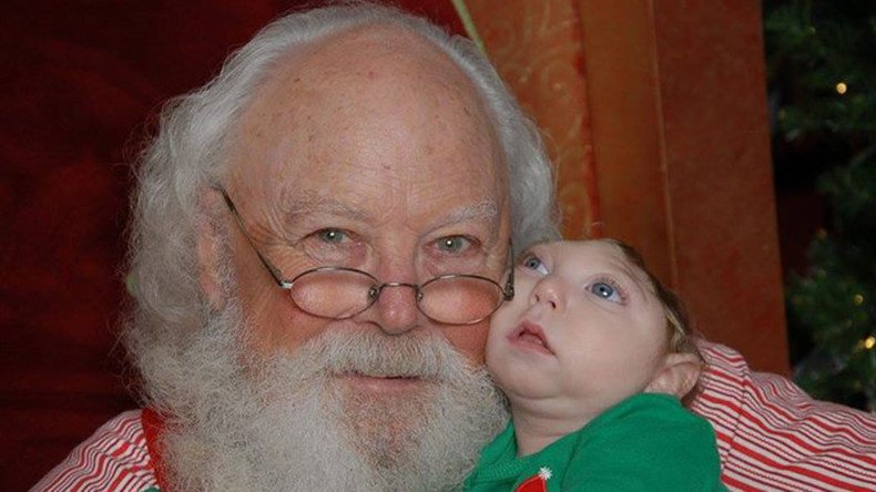 Miracle baby: Child born without most of brain meets Santa 