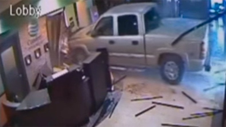 Angry man narrowly misses workers when driving into hotel lobby (VIDEO)