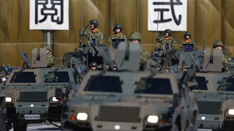 Japan cabinet approves record military budget aiming at tighter spying co-op with US