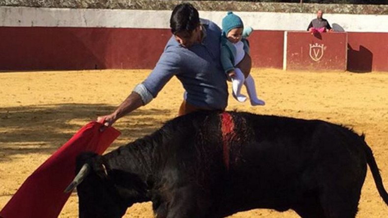 Matador fights bull while clutching 5-month old daughter, internet vents fury