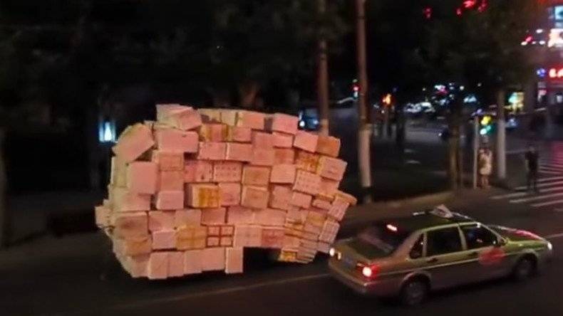 Special delivery: Motorcycle, somehow, transports dozens of boxes