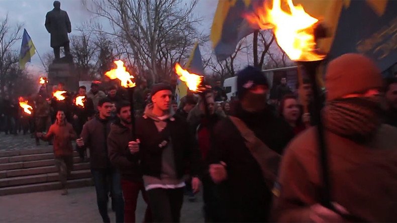 Ukrainian far-right fighters hold Nazi-inspired torch march in Odessa to commemorate slain friends