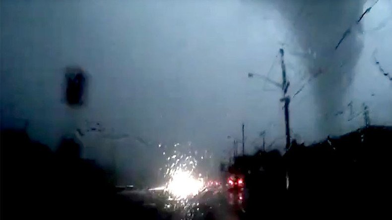 ‘Did not see that coming’: Driver careers inches from tornado, claims not to have noticed it (VIDEO)