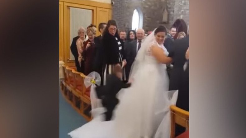Ninja kid attacks wedding dress while bride walks down the aisle (VIDEO)