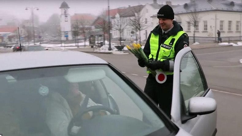 Russian & Lithuanian police offer flowers to female motorists for International Women’s Day