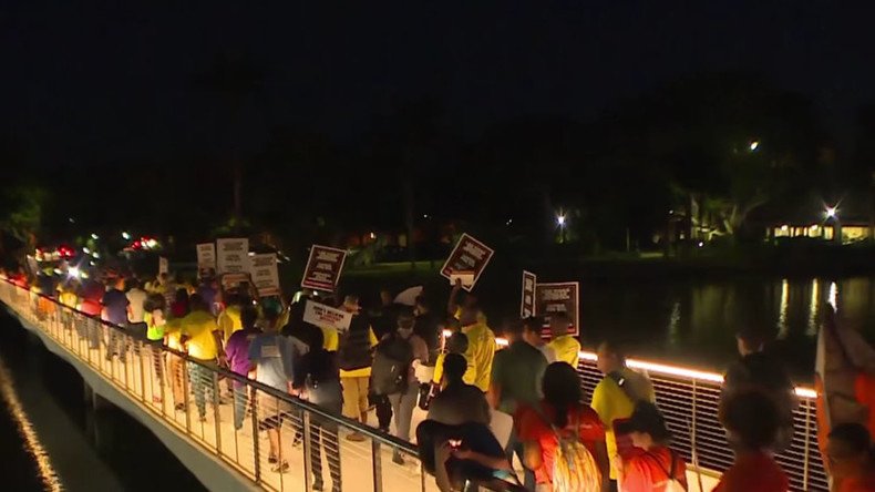 Protesters swamp Miami outside GOP debate, fight for $15 min wage