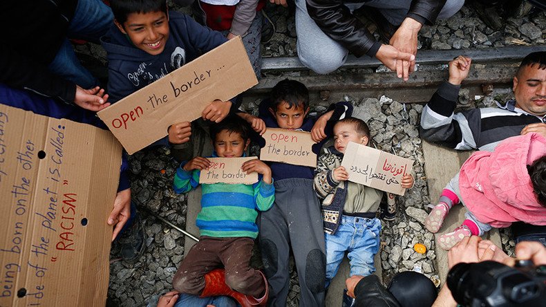 Refugee children laid on rails in Greek camp to protest closed border (VIDEO)