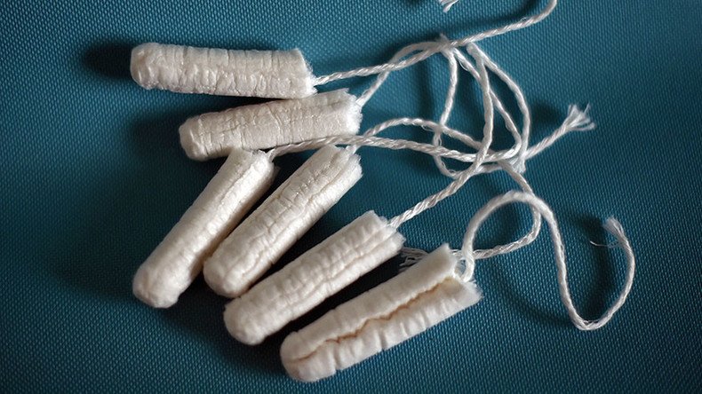 ‘Begging for a tampon’: Tory tax forces women to use newspapers & socks, claims charity
