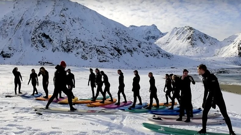 Endless winter: Insane arctic surfers tame Norway’s icy waves (VIDEO)